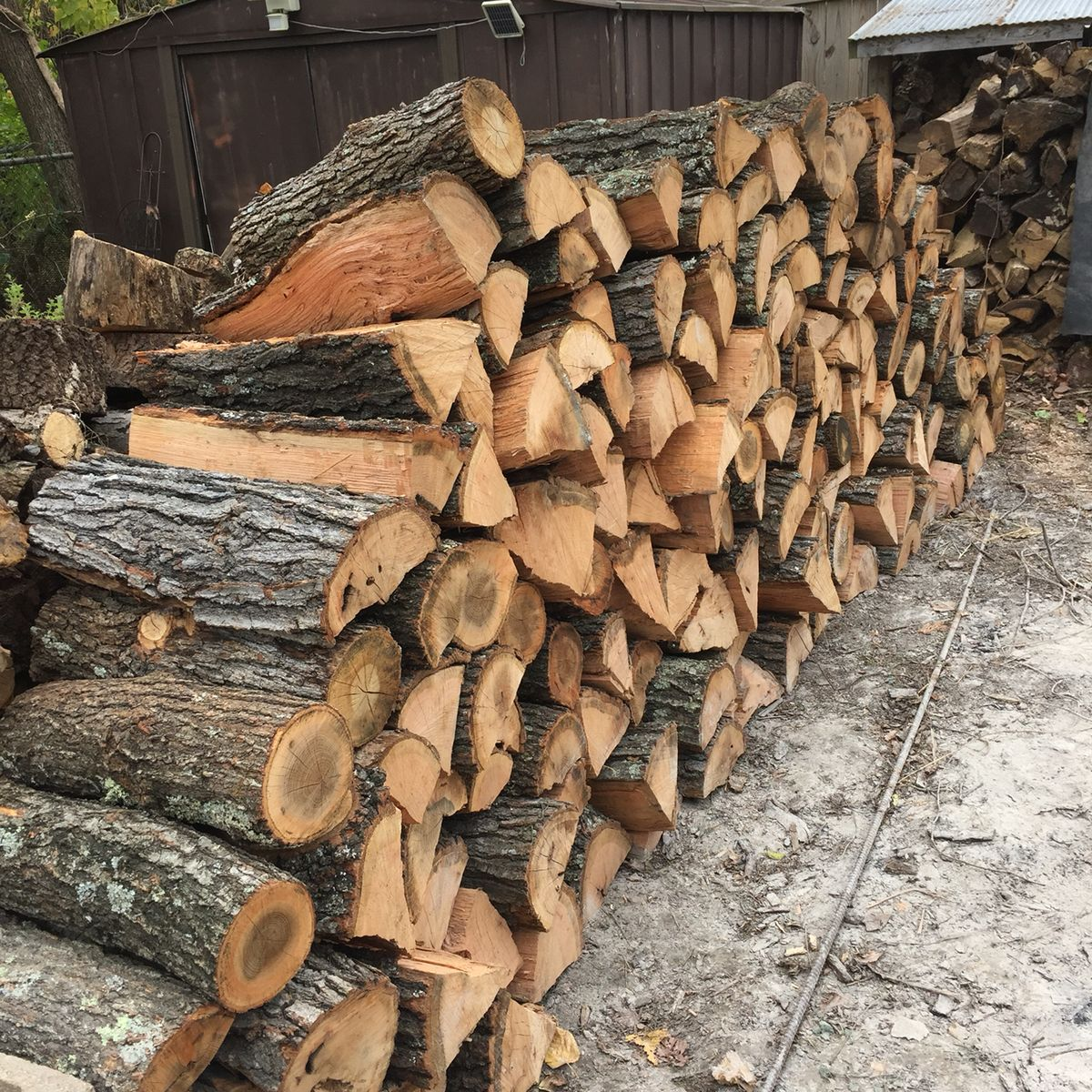 A stack of chopped firewood. Logs are cut and ready for burning.